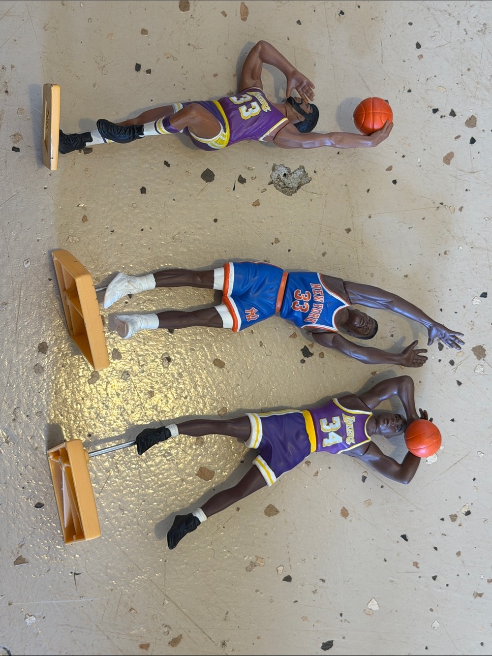 vintage action figures are from the Kenner Starting Lineup NBA series